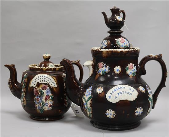 Two Bargeware teapots, height 33.5cm and 21cm